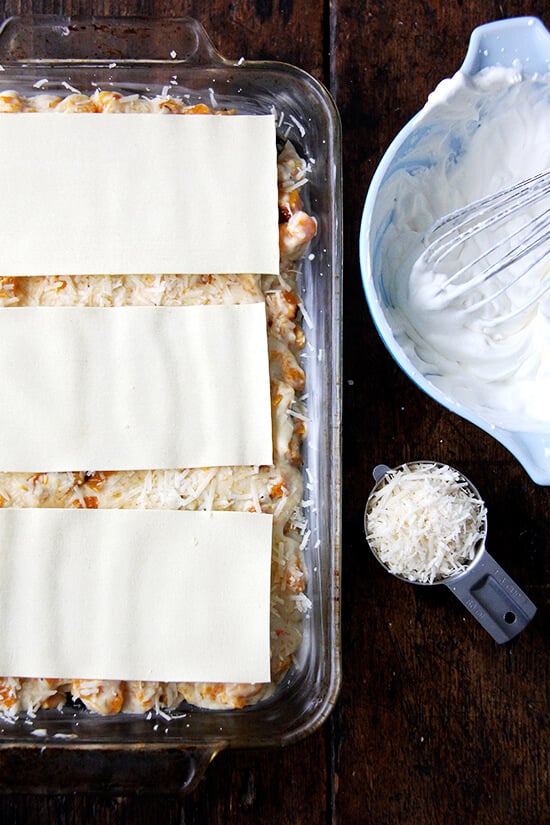 A 9x13-inch pan filled with unbaked butternut squash lasagna. 