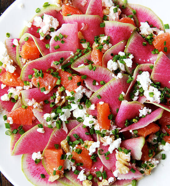 Watermelon radish salad with goat cheese, oranges, and walnuts.