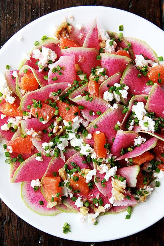 Watermelon radish salad with goat cheese, orange, and walnuts.