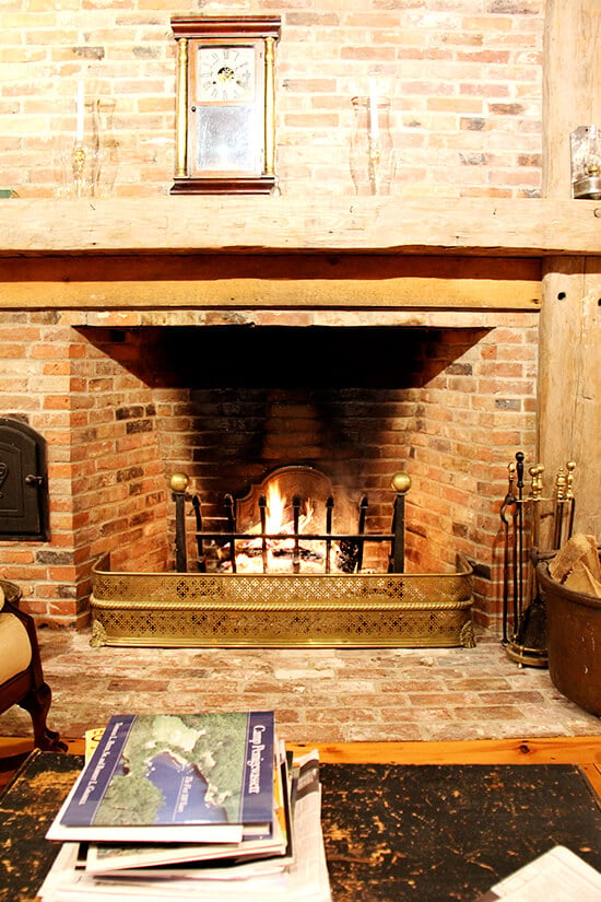 A roaring fire in a brick fireplace. 