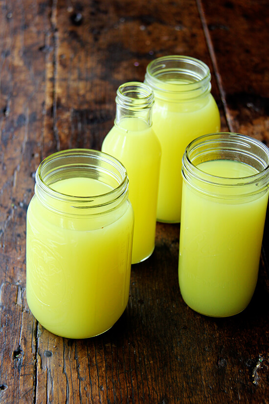 Glass jars filled with homemade limoncello. 