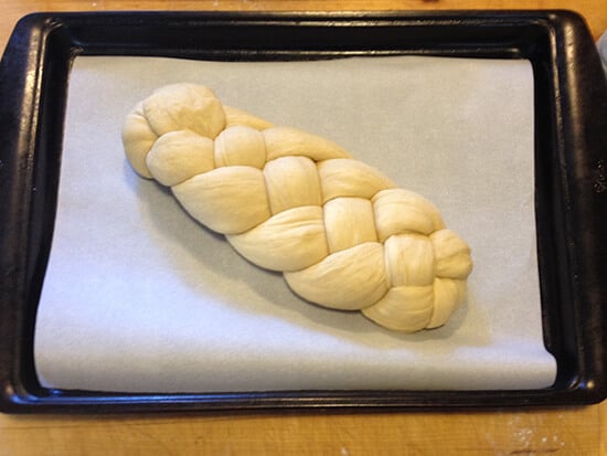 Holly's challah bread on a sheet pan, ready for the oven.