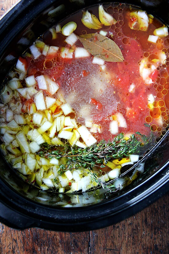 A crockpot filled with slow cooker white beans ready to start cooking.