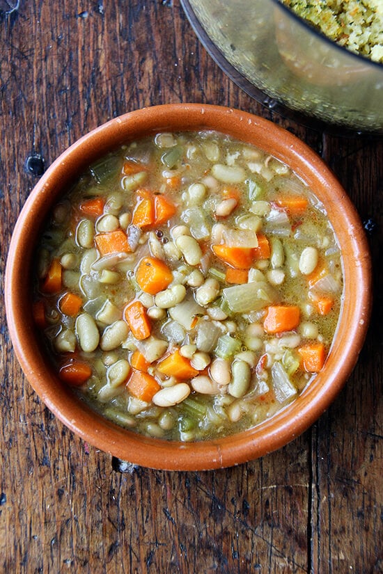 In the span of two weeks, I have managed to deplete a many-years-old supply of dried beans, including flageolets, freeing my pantry of half a dozen half-filled boxes and countless rubber band-bound bags (some holding mere tablespoons of beans). Yes, you guessed it, I have my slow cooker to thank for this small but very satisfying feat. // alexandracooks.com