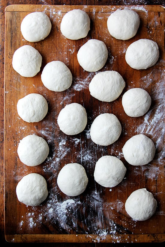 A board holding portioned bialy dough.