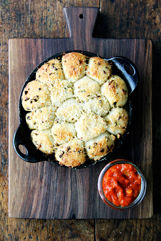 This garlic and thyme monkey bread with spicy tomato sauce would nicely complement any pasta dish (for all of you carb lovers that is) but would also be wildly received at any sort of Super Bowl gathering. // alexandracooks.com