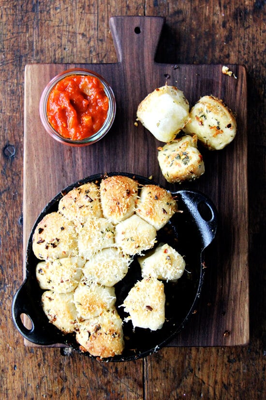 This garlic and thyme monkey bread with spicy tomato sauce would nicely complement any pasta dish (for all of you carb lovers that is) but would also be wildly received at any sort of Super Bowl gathering. // alexandracooks.com