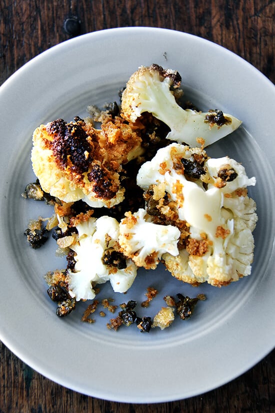 Minimal ingredients, minimal hands on time, this whole-roasted cauliflower with fried capers and brown butter breadcrumbs is a winner. The cauliflower emerges from the oven knife tender but not mushy. Here, the head's edges crisp and caramelize both from the heat of the oven and the oil pooling in the bottom of the pan, and the nutty crumbs and burst capers that nestle in the web of stems and spill all around the serving platter couldn't be more irresistible. // alexandracooks.com