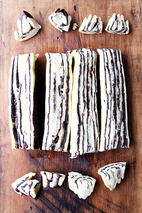 cutting the babka dough in preparation for twisting. 