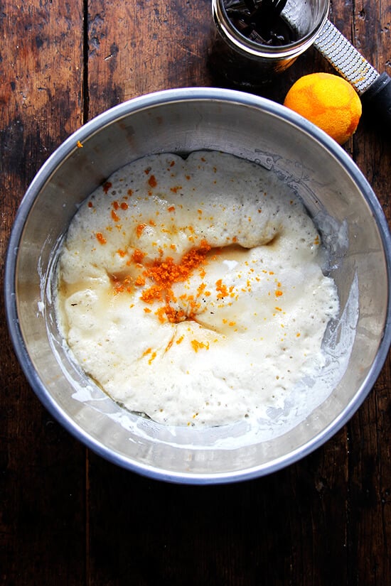 Adding orange zest to the dough sponge. 