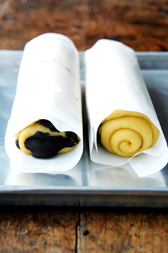 Coiled rolls of dough on a sheetpan. 