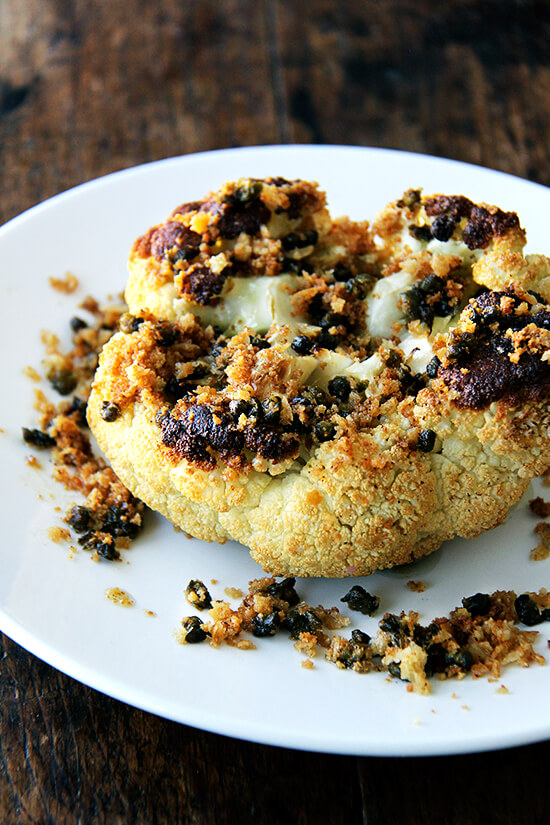 Minimal ingredients, minimal hands on time, this whole-roasted cauliflower with fried capers and brown butter breadcrumbs is a winner. The cauliflower emerges from the oven knife tender but not mushy. Here, the head's edges crisp and caramelize both from the heat of the oven and the oil pooling in the bottom of the pan, and the nutty crumbs and burst capers that nestle in the web of stems and spill all around the serving platter couldn't be more irresistible. // alexandracooks.com