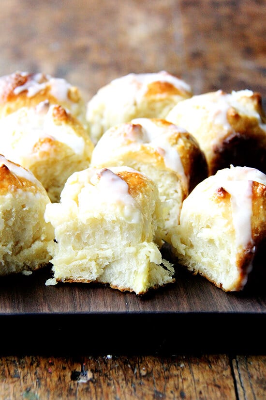 These hot cross buns can be mixed and baked in the same day, but isn't it more fun to pull a pan from the fridge, pop it in the oven, and relax with the paper while the smell of freshly baked sweet buns fills the air? // alexandracooks.com