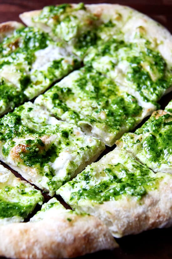 In this pesto pizza, while the pizza isn't baked completely naked, the process is similar: scatter cheese lightly across dough, drizzle it with olive oil and bake it until bubbling. Immediately upon pulling it from the oven, brush it with a thinned-out ramp pesto and a sprinkling of sea salt. Withholding the pesto from the pizza until it's out of the oven preserves not only its sharp, punchy flavor but also its vibrant green color. // alexandracooks.com