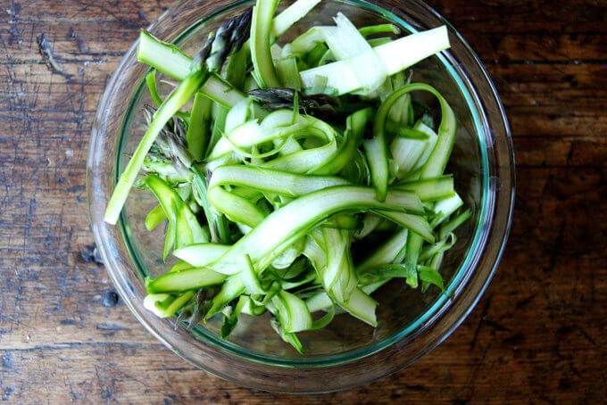 Shaved asparagus in a bowl.