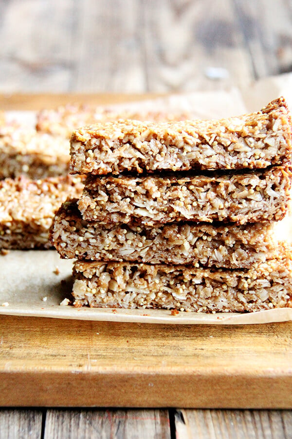 In these granola bars, I use oats, coconut, almonds and millet for the dry ingredients, the same makeup as the granola. For the glue, I use coconut oil or butter, maple syrup, brown rice syrup and almond butter. They hold their shape at room temperature and have thus become a lunch box staple. // alexandracooks.com