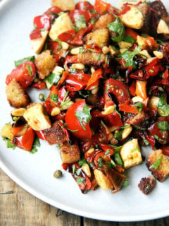 Folded into olive oil-fried bread, this magic peppers salad made a lovely panzanella salad but could have easily become a bruschetta or simple grain or pasta salad. Much to my delight, making this panzanella felt nothing like hard work. It was almost as though the salad assembled itself. Perhaps "hard work" is a state of mind. Hmm...deep thoughts. // alexandracooks.com