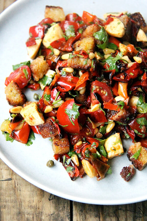 Folded into olive oil-fried bread, this magic peppers salad made a lovely panzanella salad but could have easily become a bruschetta or simple grain or pasta salad. Much to my delight, making this panzanella felt nothing like hard work. It was almost as though the salad assembled itself. Perhaps "hard work" is a state of mind. Hmm...deep thoughts. // alexandracooks.com