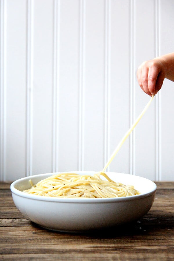 Cacio e pepe, a classic Italian dish, relies on starchy pasta cooking water to form a creamy emulsion with butter and cheese, often Parmigiano Reggiano and Pecorino Romano, and it couldn't be more delicious or simple. I like simple. // alexandracooks.com