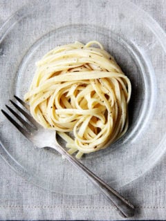 Cacio e pepe, a classic Italian dish, relies on starchy pasta cooking water to form a creamy emulsion with butter and cheese, often Parmigiano Reggiano and Pecorino Romano, and it couldn't be more delicious or simple. I like simple. // alexandracooks.com