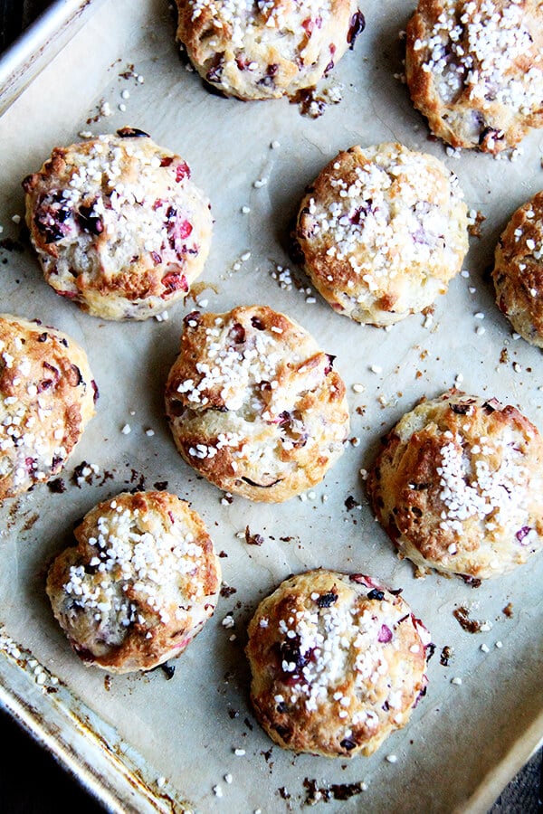 An overhead shot of a tray of freshly baked cranberry scones. 