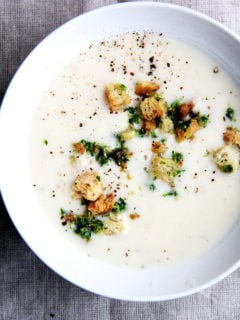 Recently, I've been living on this recipe for Fisher's creamy potato soup. Simple and delicious, the ingredients come together quickly: sauté two onions, add four peeled potatoes and water, simmer till tender, add milk (thickened with a roux), and purée. A deeply satisfying soup perfect for the colder months of the year! // alexandracooks.com