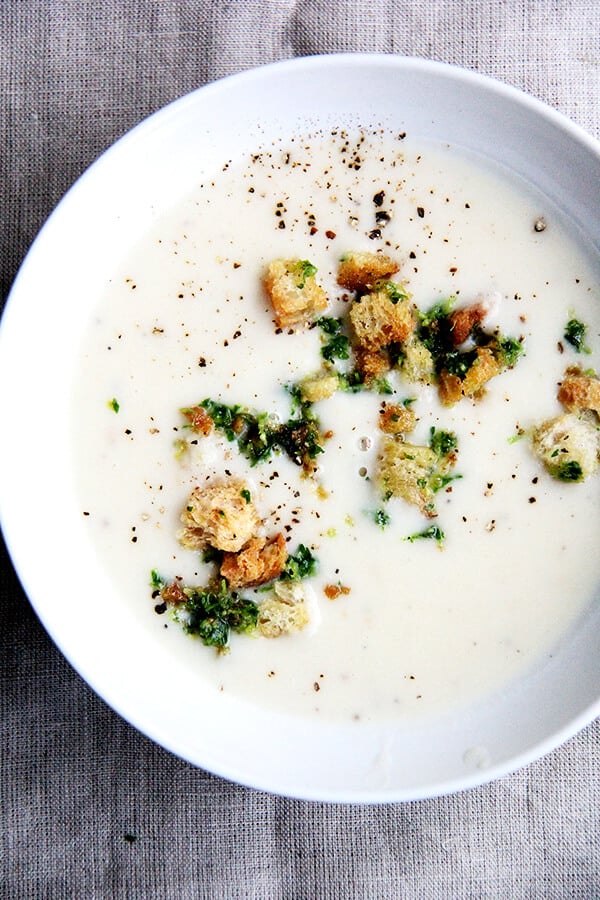 Recently, I've been living on this recipe for Fisher's creamy potato soup. Simple and delicious, the ingredients come together quickly: sauté two onions, add four peeled potatoes and water, simmer till tender, add milk (thickened with a roux), and purée. A deeply satisfying soup perfect for the colder months of the year! // alexandracooks.com