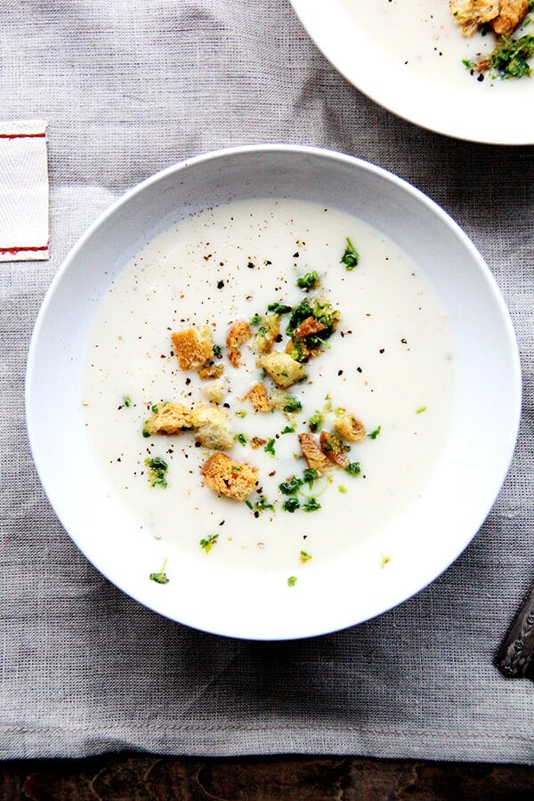 Recently, I've been living on this recipe for Fisher's creamy potato soup. Simple and delicious, the ingredients come together quickly: sauté two onions, add four peeled potatoes and water, simmer till tender, add milk (thickened with a roux), and purée. A deeply satisfying soup perfect for the colder months of the year! // alexandracooks.com