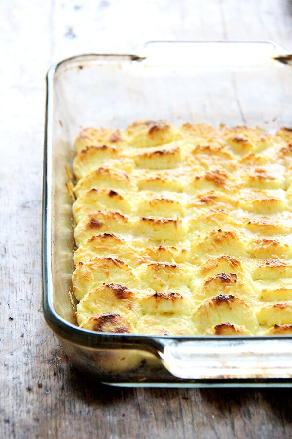 Made with milk, semolina flour, parmesan and egg yolks, this baked semolina gnocchi bears little resemblance to potato gnocchi. They taste more like polenta in fact, but are lighter in texture. In addition to being incredibly delicious, the beauty of gnocchi alla Romana is that it can be completely assembled ahead of time — up to two days — and baked just before serving. // alexandracooks.com