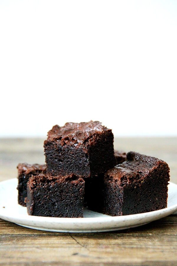 A stack of the best ever fudgy brownie recipe on a plate. 