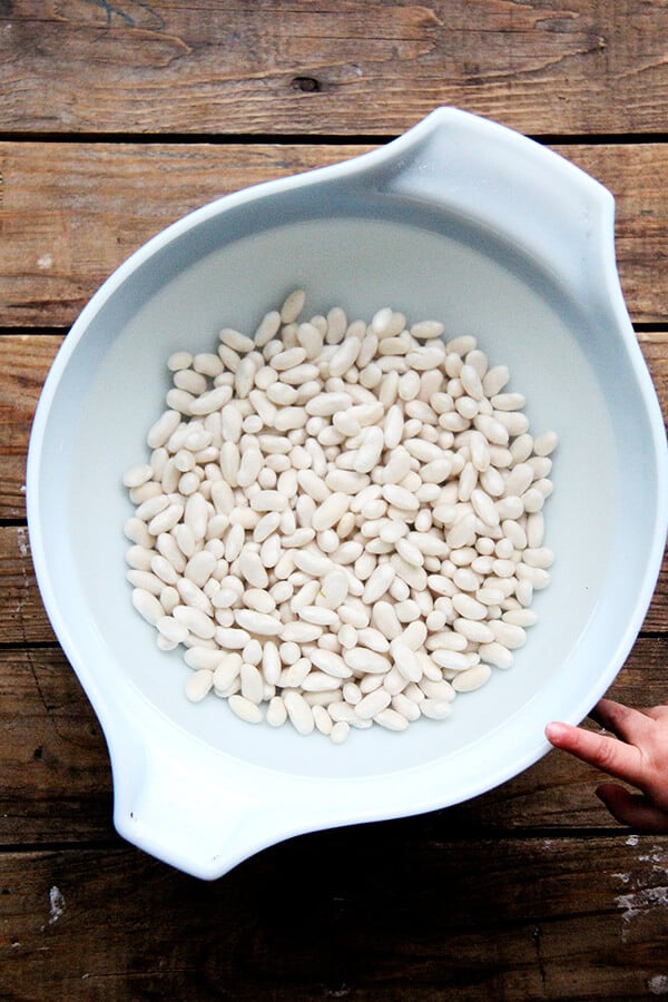 A bowl of water and soaking beans.