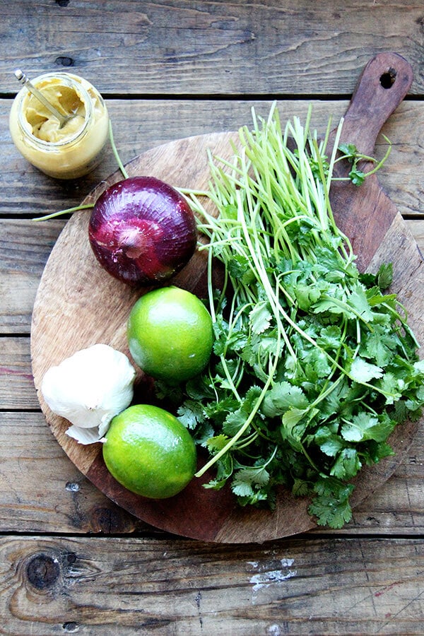 ingredients for cilantro-lime dressing on a board. 