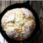 A cast iron skillet filled with Irish soda bread.