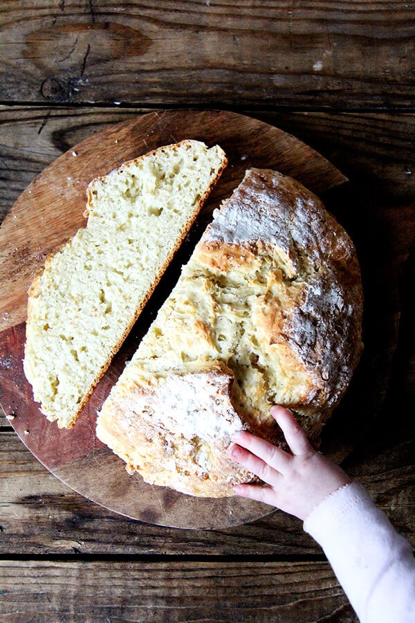 Overhead shot of a loaf of Irish soda bread, sliced. 