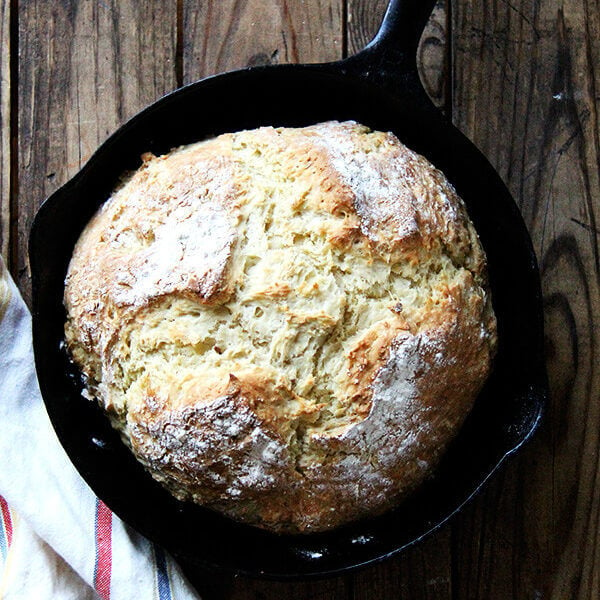 A cast iron skillet of just-baked Irish soda bread.