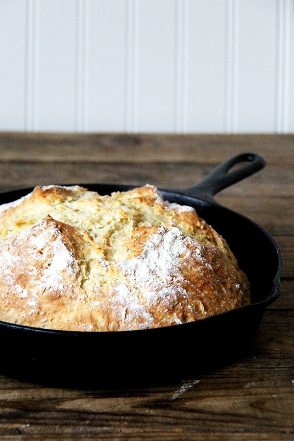 Just baked Irish soda bread in a cast iron skillet, sideview. 