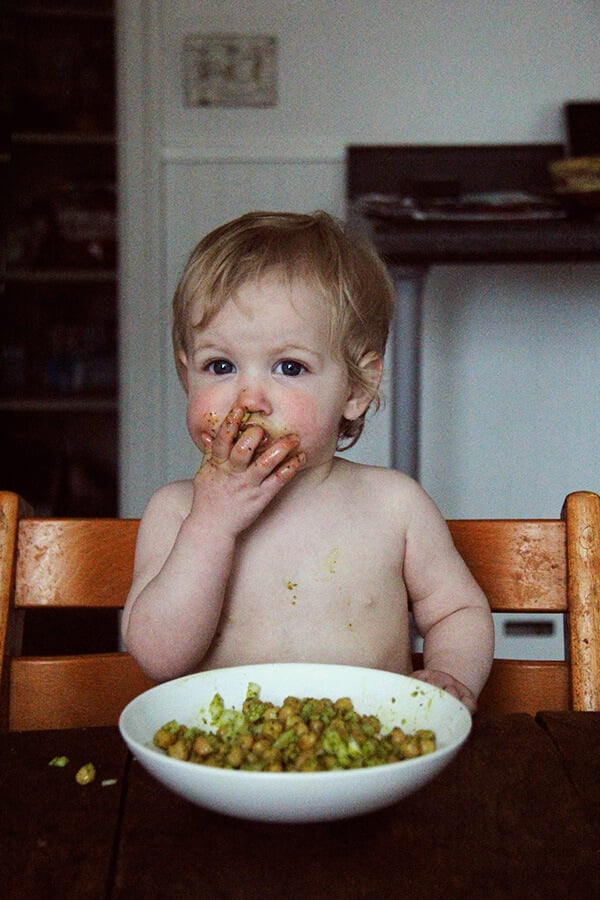 Baby eating cilantro-lime chickpeas.