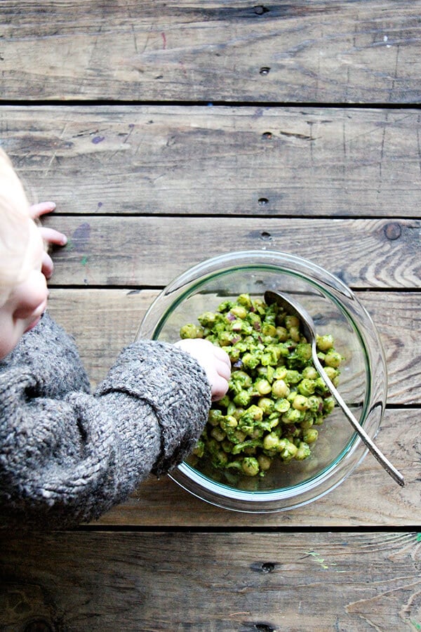 Baby eating cilantro-lime chickpeas.