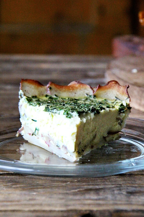 A slice of potato-crusted quiche. 