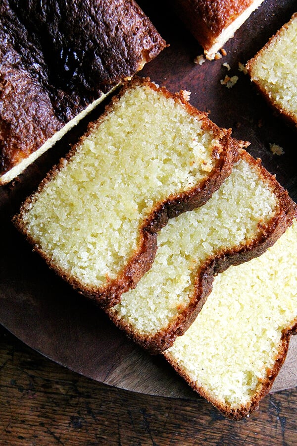 A sliced loaf of lemon semolina cake. 