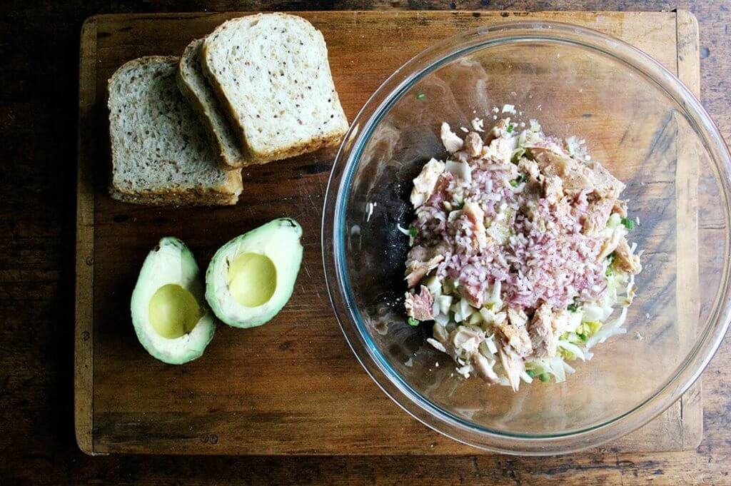 Components to make trout and avocado salad. 