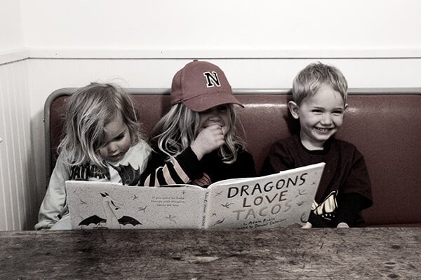 Kiddos reading Dragons Love Tacos.