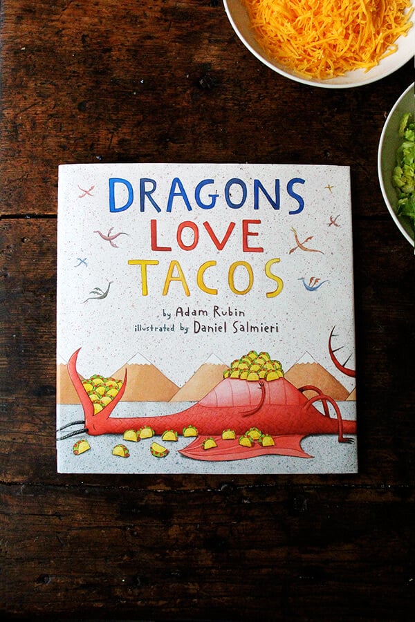 Dragons Love Tacos book on the table. 