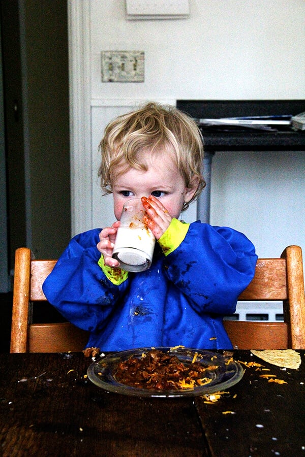 Tig, drinking milk and eating tacos. 