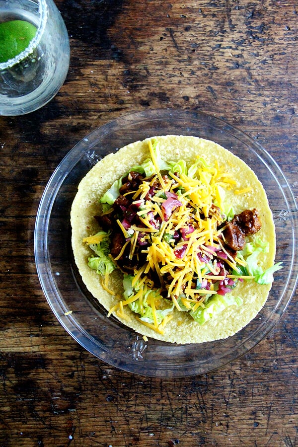 A plate topped with the simplest chicken taco.