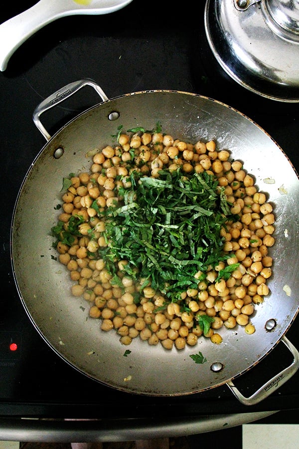 chickpeas and basil in pan