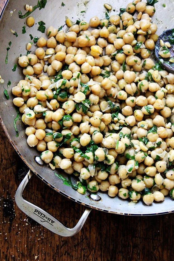 chickpeas and basil in pan