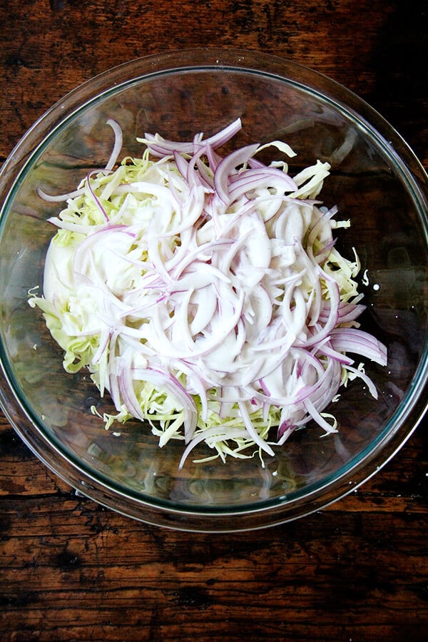 Cabbage arrives as early as those tender greens and continues through the fall and early winter. Make this cabbage slaw spicy with a few dashes of Tabasco, add herbs, add other vegetables, or just keep it simple. // alexandracooks.com