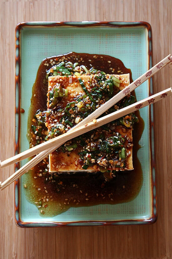 Tofu with sesame sauce on a platter.