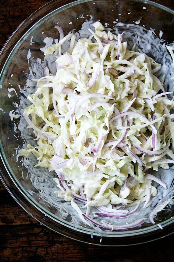 Cabbage arrives as early as those tender greens and continues through the fall and early winter. Make this cabbage slaw spicy with a few dashes of Tabasco, add herbs, add other vegetables, or just keep it simple. // alexandracooks.com